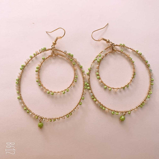 Gold hoop earrings with green beads
